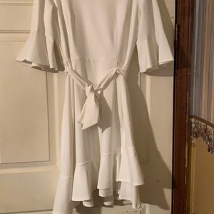 Beautiful white ruffled bell sleeve dress